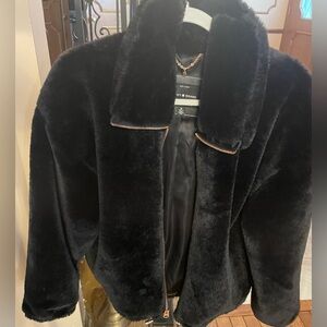 Furry bomber jacket. Gold zipper extends to Collar for extra warmth. 2 pockets.